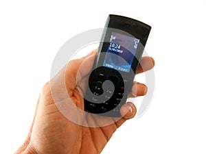 Hand holding an old style cel phone with white background - disconnected unplugged no smartphone