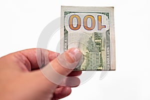 Hand holding one hundred dollar isolated on white background. Man hand giving 100 dollar bill. One hundred us dollars