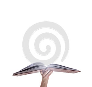 Hand holding opened magic book