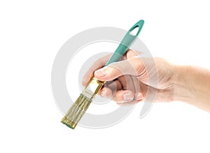 Hand holding a paint brush. Close up. Isolated on a white background