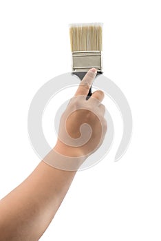 Hand holding paint brush with plastic black handle isolated
