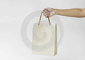 Hand holding paper bag mockup