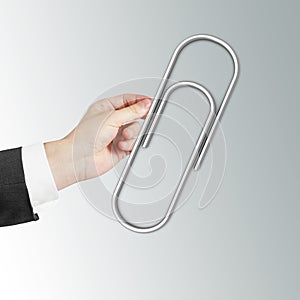 Hand holding Paper clip