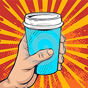 Hand holding a paper cup of coffee in pop art retro comic style.