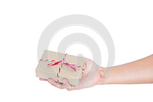 Hand holding parcel post gift box, isolated on white background with copy space