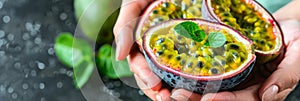 Hand holding passion fruit on blurred background with ample text space for placements