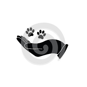 Hand holding paw icon. Animal care and protect