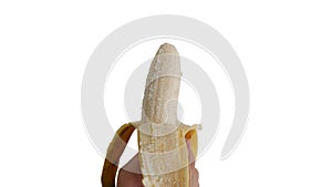 Hand holding a peel banana