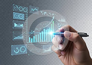 A hand holding a pen interacting with a virtual graph and chart interface