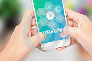 Hand holding the phone label CASH FLOW message, Can be used in advertising