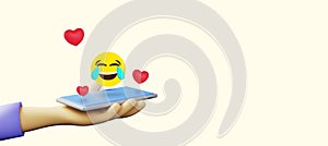 Hand holding phone with laughing emoji and hearts 3D illustration banner heading with copyspace