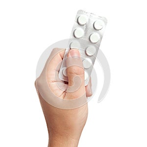 Hand holding pills