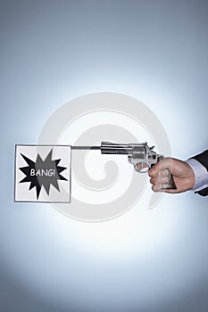 Hand Holding Pistol With Bang Flag