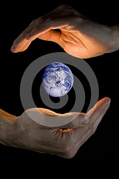 Hand holding planet earth