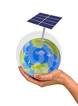 Hand holding planet earth globe and solar panel.
