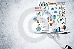 Hand holding plate with drawing global marketing plan