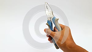 Hand holding pliers in blue and grey colored on a white background