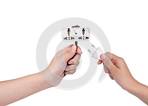 Hand holding plug isolated on white background