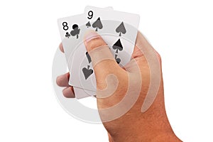 Hand holding a poker cards isolated on white background