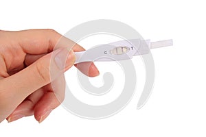 Hand holding positive result pregnancy test