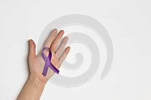 Hand holding Purple ribbons on a white background. World epilepsy day