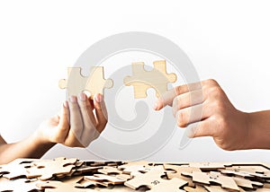 Hand holding the puzzle jigsaw. the concept of team building and success together.