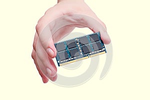 Hand holding RAM stick