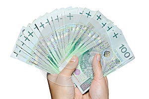 Hand holding range of polish 100 pln banknotes