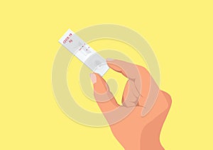 Hand holding Rapid kits of Covid-19 Ag test or ATK on yellow background