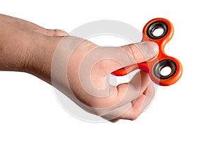 Hand holding red fidget spinner