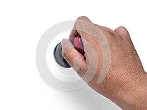 Hand holding red handled round rubber stamp, top view isolated on white