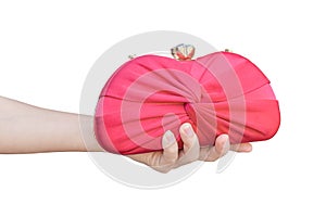 hand holding red luxury clutch bag isolated on white background