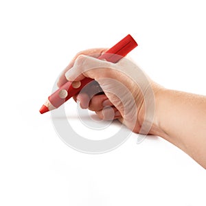 Hand holding a red pencil