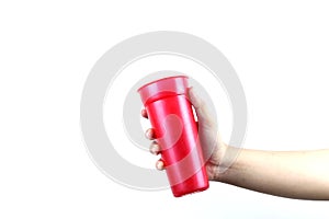 hand holding red plastic cup isolated on a white background