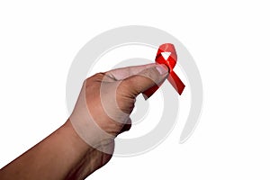 Hand holding red ribbon. Aids Awareness Sign Red Ribbon for World Aids Day concept . World Aids Day symbol for Aids campaigne -