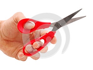 Hand holding red scissors isolated on white background