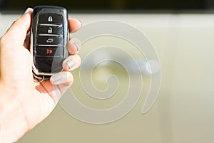 Hand holding remote car key