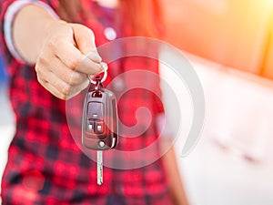 Hand holding the remote control car alarm systems