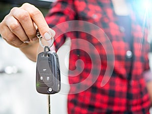 Hand holding the remote control car alarm systems