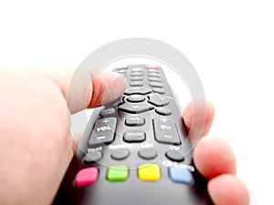 Hand holding a remote control TV isolated on white background