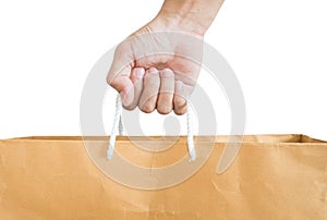Hand holding reuse paper bag, isolated on white background