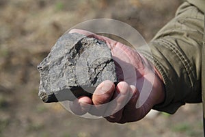 Hand holding rock