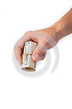 Hand holding a roll of 100 usd