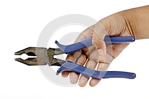 A hand holding a rusted and beatup industrial blue pliers