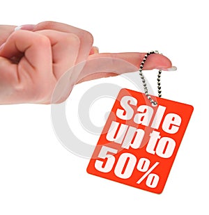 Hand holding sale tag