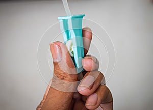 Hand holding saline IV drip for patient