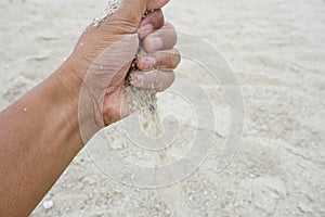 Hand holding a sand
