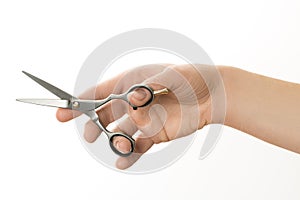 Hand holding scissors for cutting hair isolated on white