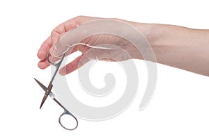 Hand holding scissors for manicure isolated on white background. Health and personal care conception