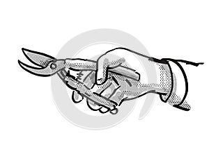 Hand holding Secateurs Garden Tool Cartoon Retro Drawing photo